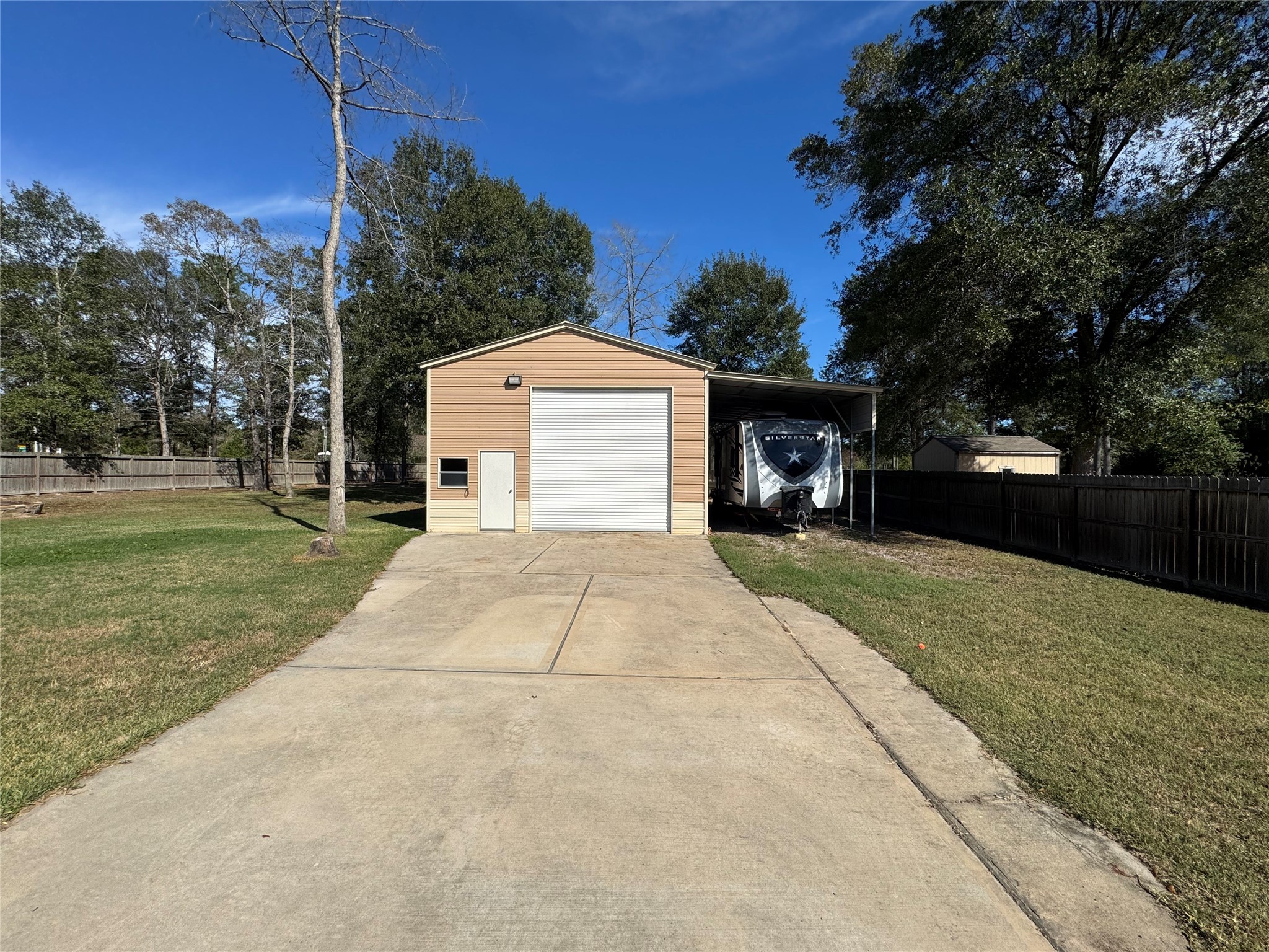 4507 Axis Trail Conroe, TX 77303 - Photo 26 of 34 a front view of a house with a yard and garage