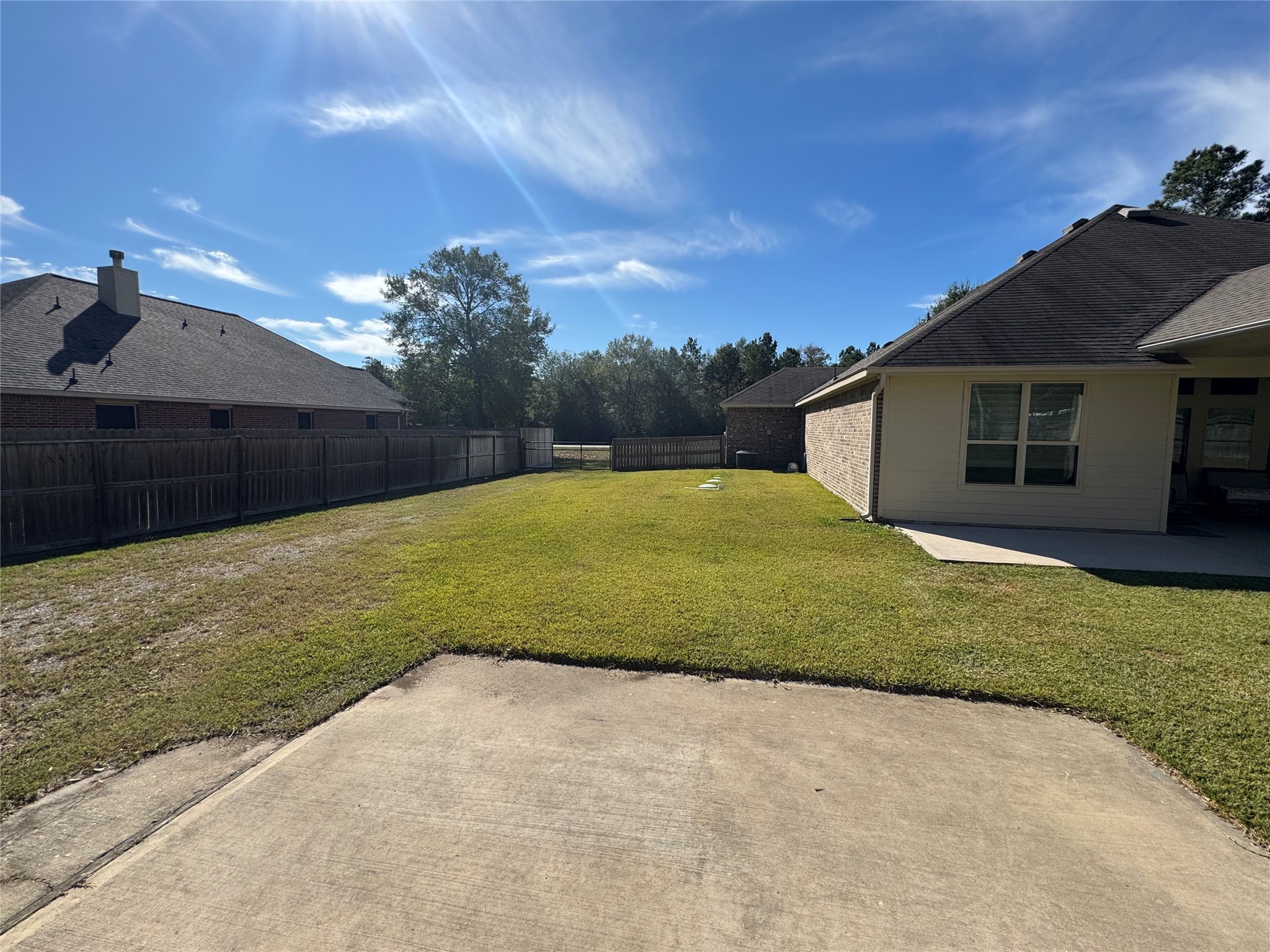 4507 Axis Trail Conroe, TX 77303 - Photo 27 of 34 a view of a backyard with a garden