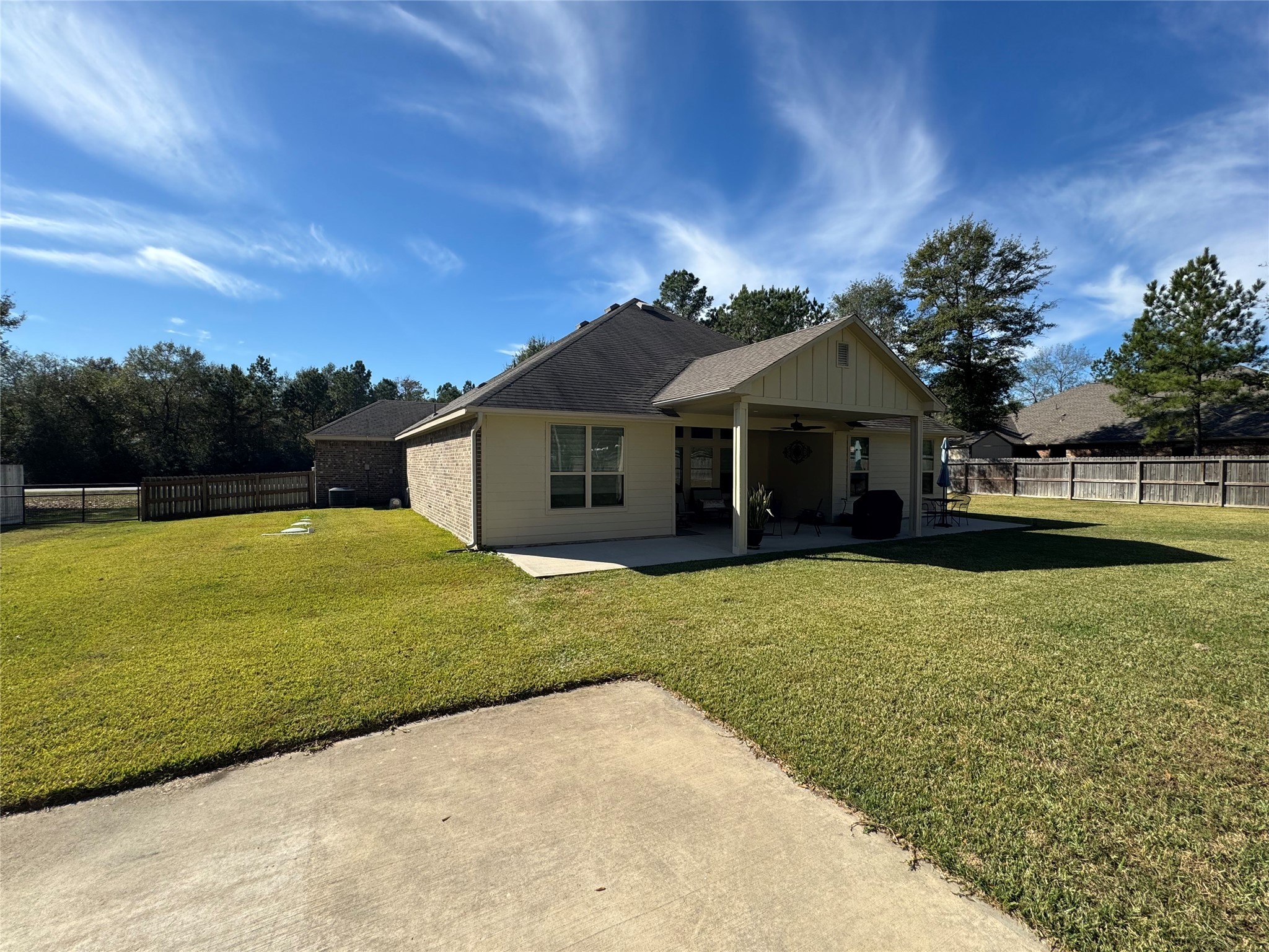 4507 Axis Trail Conroe, TX 77303 - Photo 28 of 34 a front view of a house with a garden