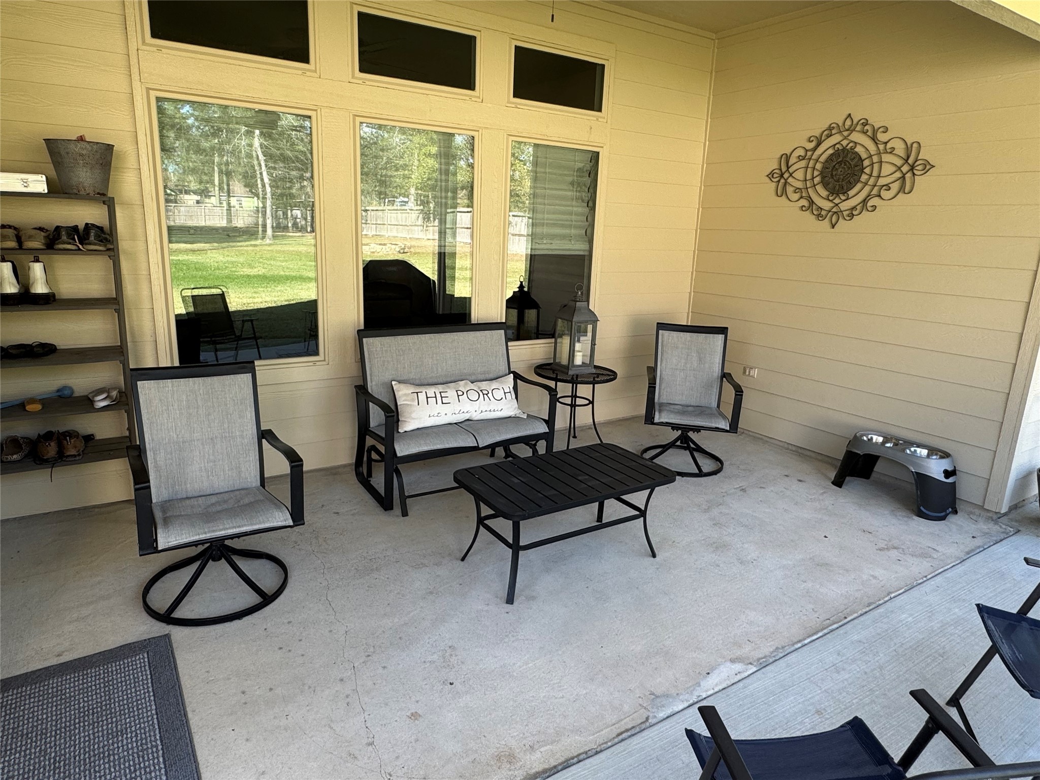 4507 Axis Trail Conroe, TX 77303 - Photo 29 of 34 a living room with furniture a rug and a floor to ceiling window