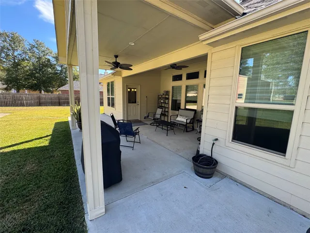 a view of a livingroom with furniture and a tub