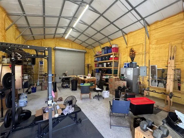 a outdoor living space with furniture and a grill