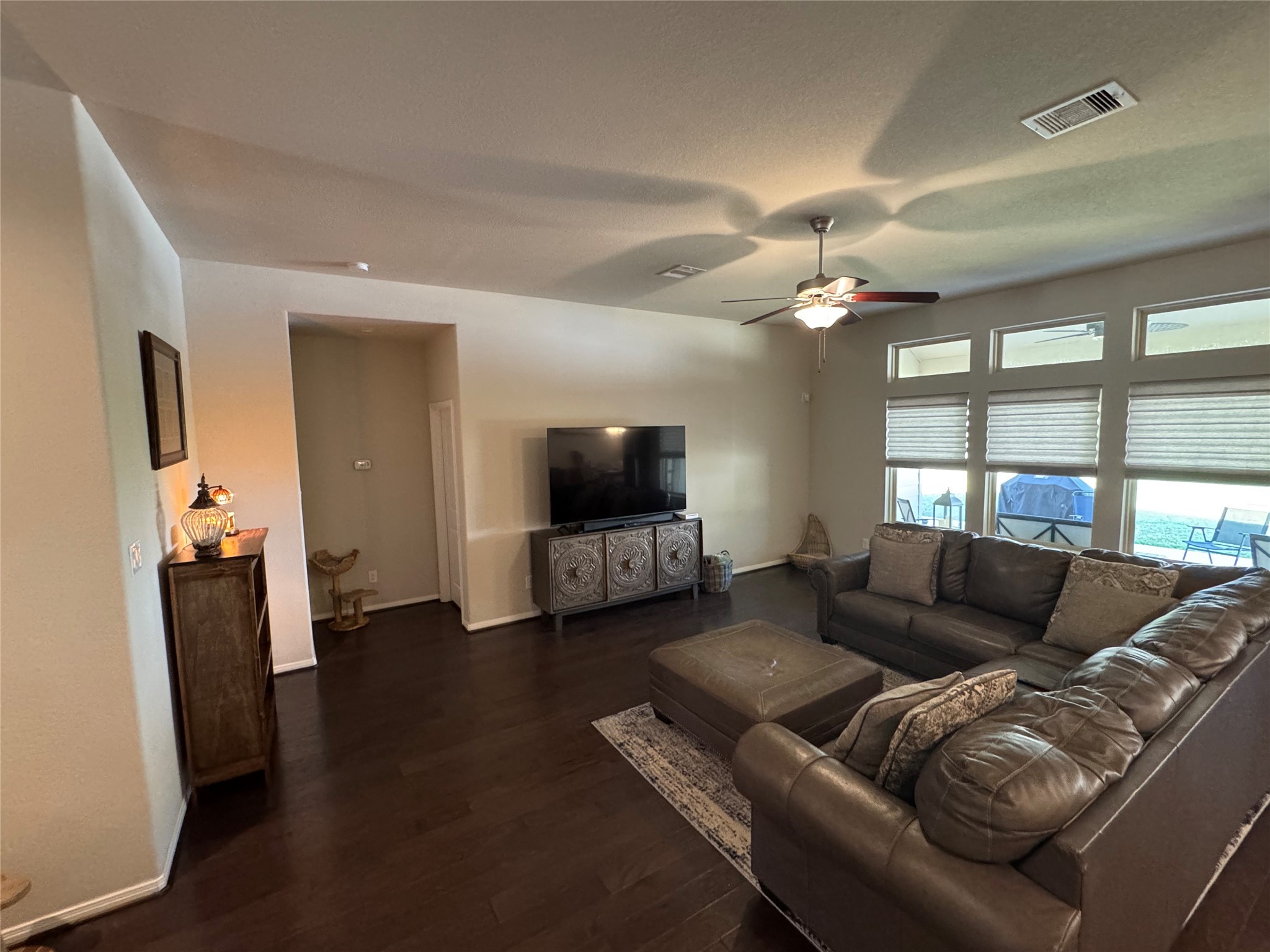 4507 Axis Trail Conroe, TX 77303 - Photo 6 of 34 a living room with furniture and a flat screen tv