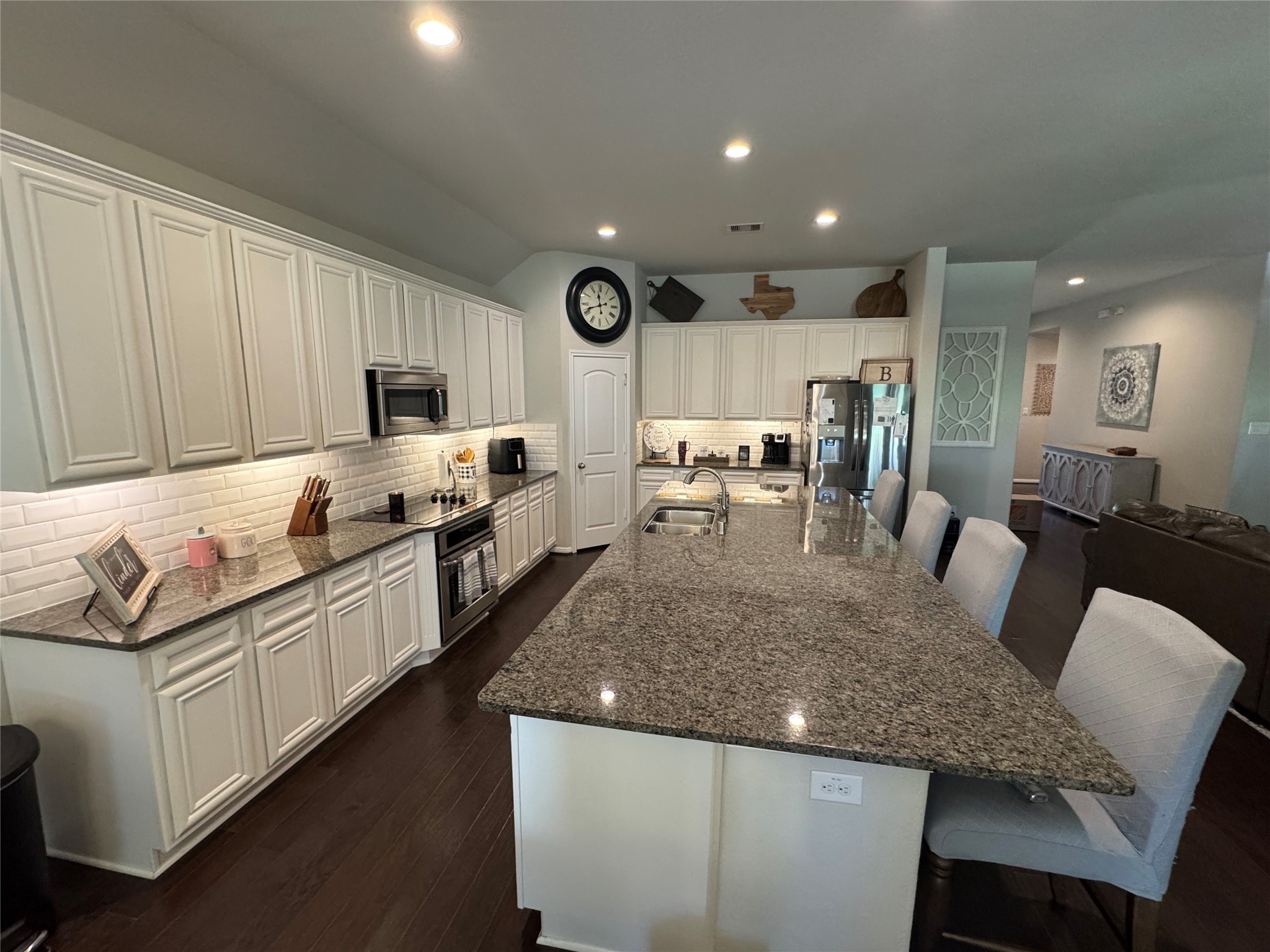 4507 Axis Trail Conroe, TX 77303 - Photo 7 of 34 a large kitchen with granite countertop lots of counter space and stainless steel appliances