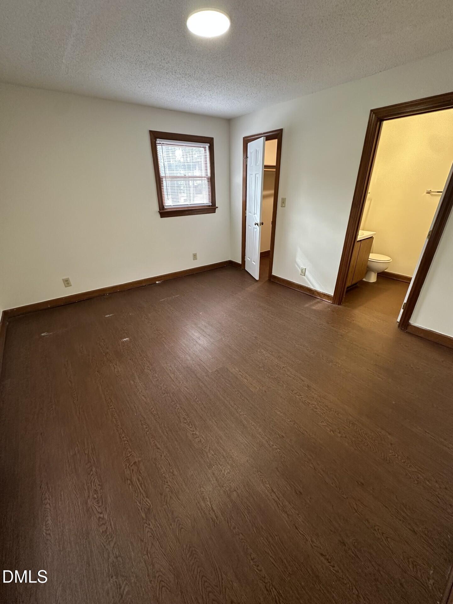 3530 Ivy Commons Drive, Unit 201 Raleigh, NC 27606 - Photo 4 of 6 a view of an empty room and window