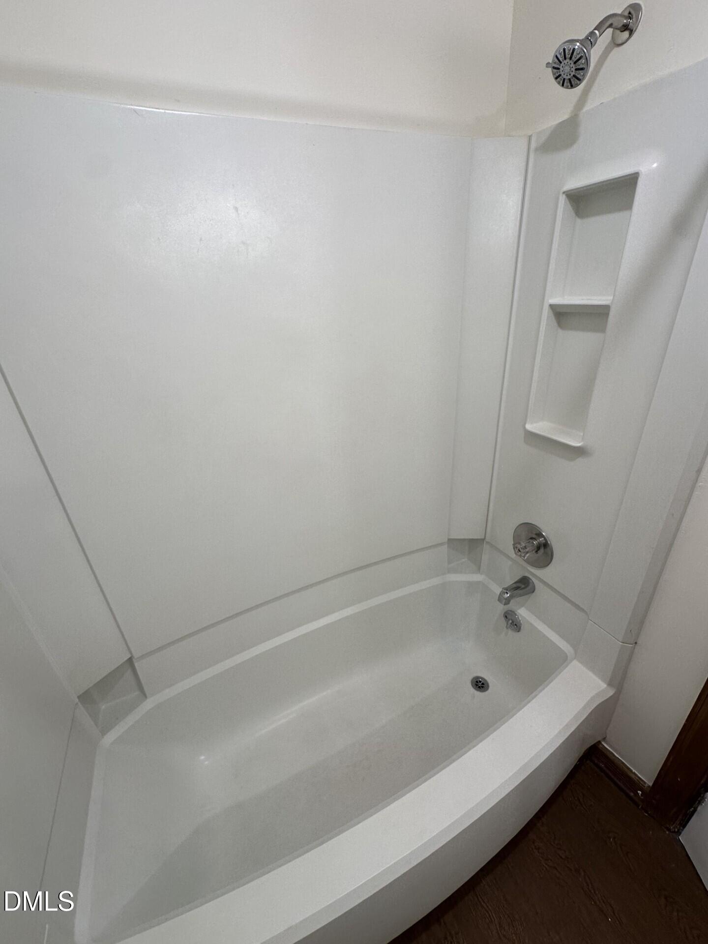 3530 Ivy Commons Drive, Unit 201 Raleigh, NC 27606 - Photo 6 of 6 a bathroom with a bathtub