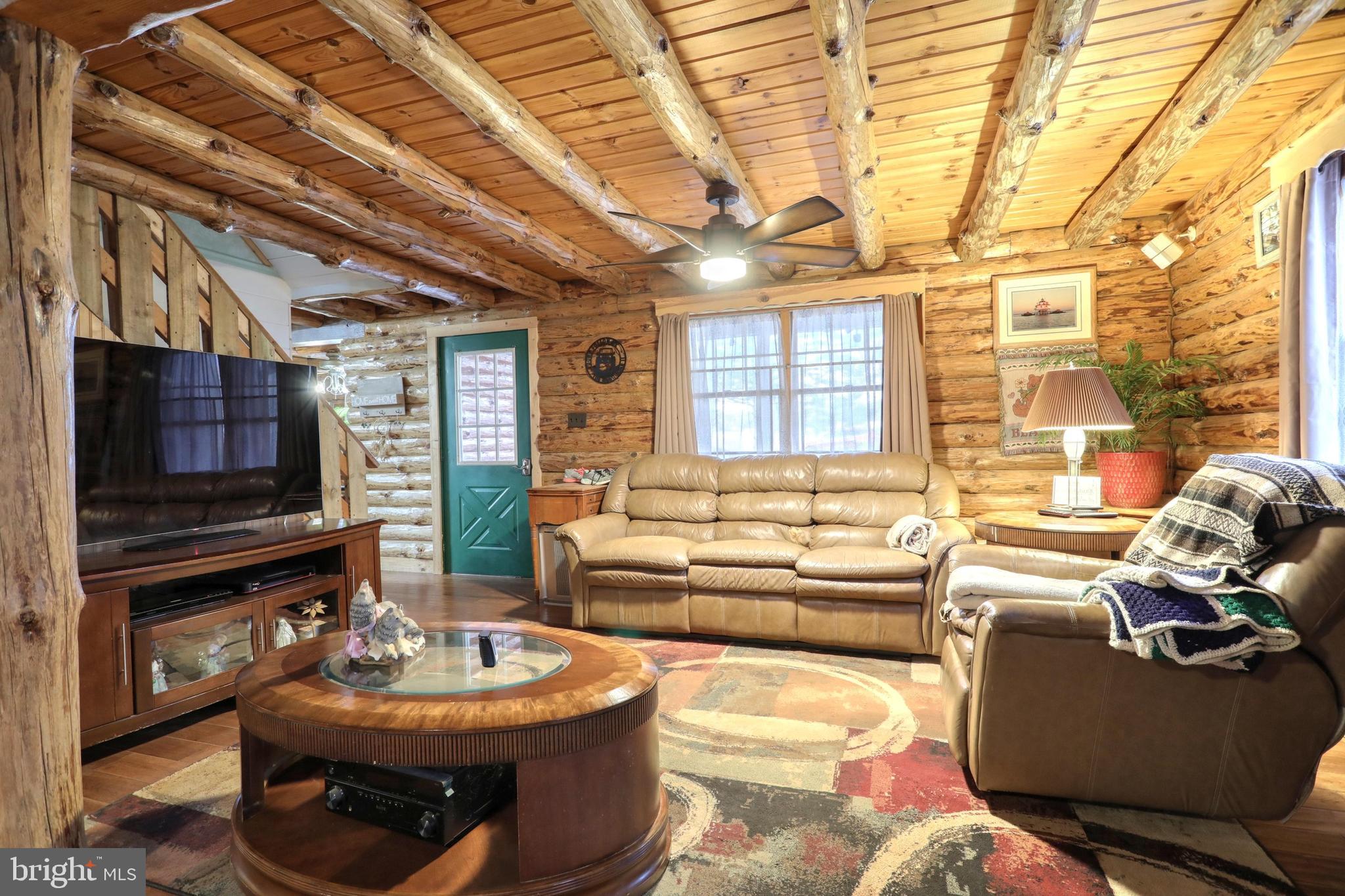 2439 Coon Club Road Westminster, MD 21157 - Photo 14 of 53 Family Room with Beamed Ceiling and Log Walls
