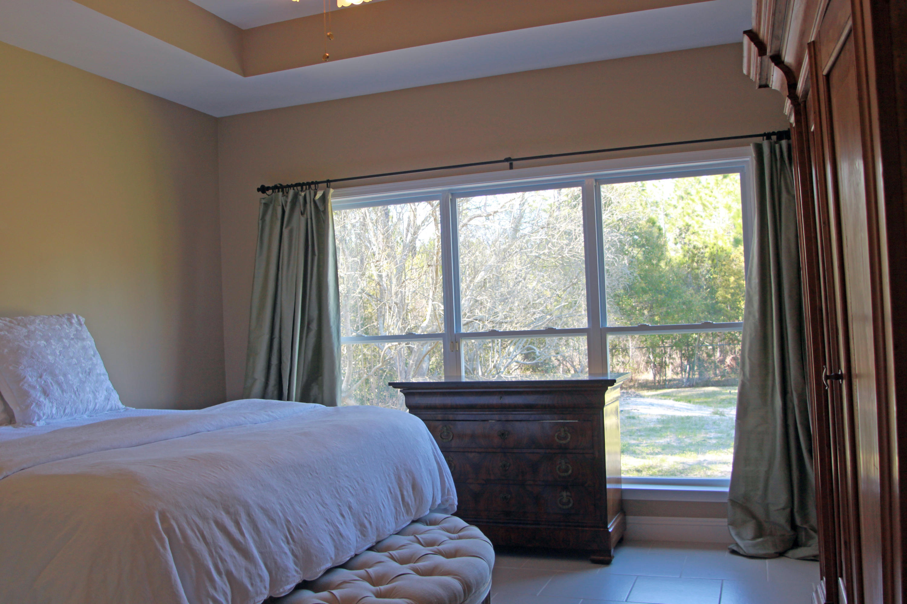 86 West Nursery Road Santa Rosa Beach, FL 32459 - Photo 12 of 20 a bedroom with a bed and a large window