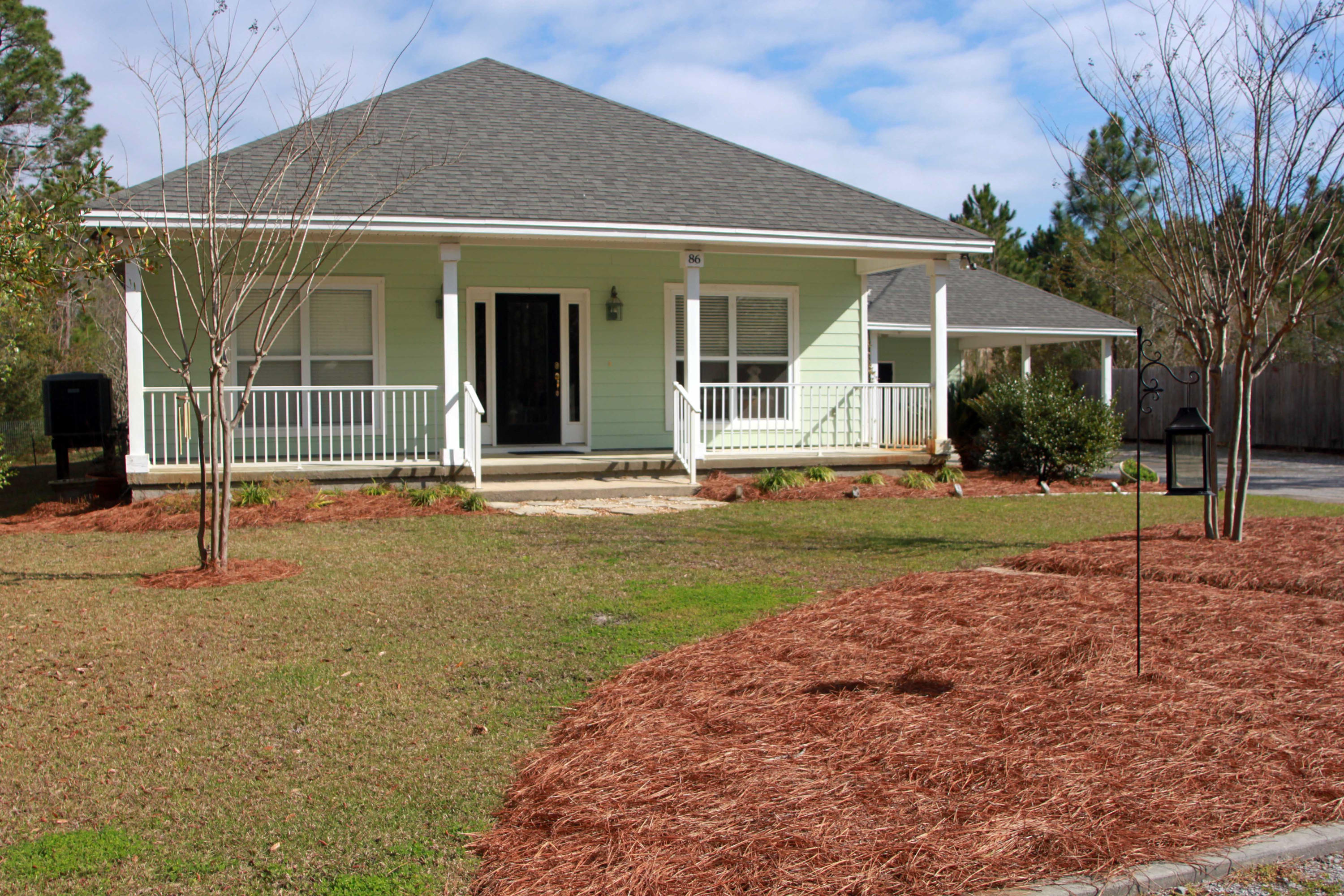 86 West Nursery Road Santa Rosa Beach, FL 32459 - Photo 2 of 20 front view of a house with a yard