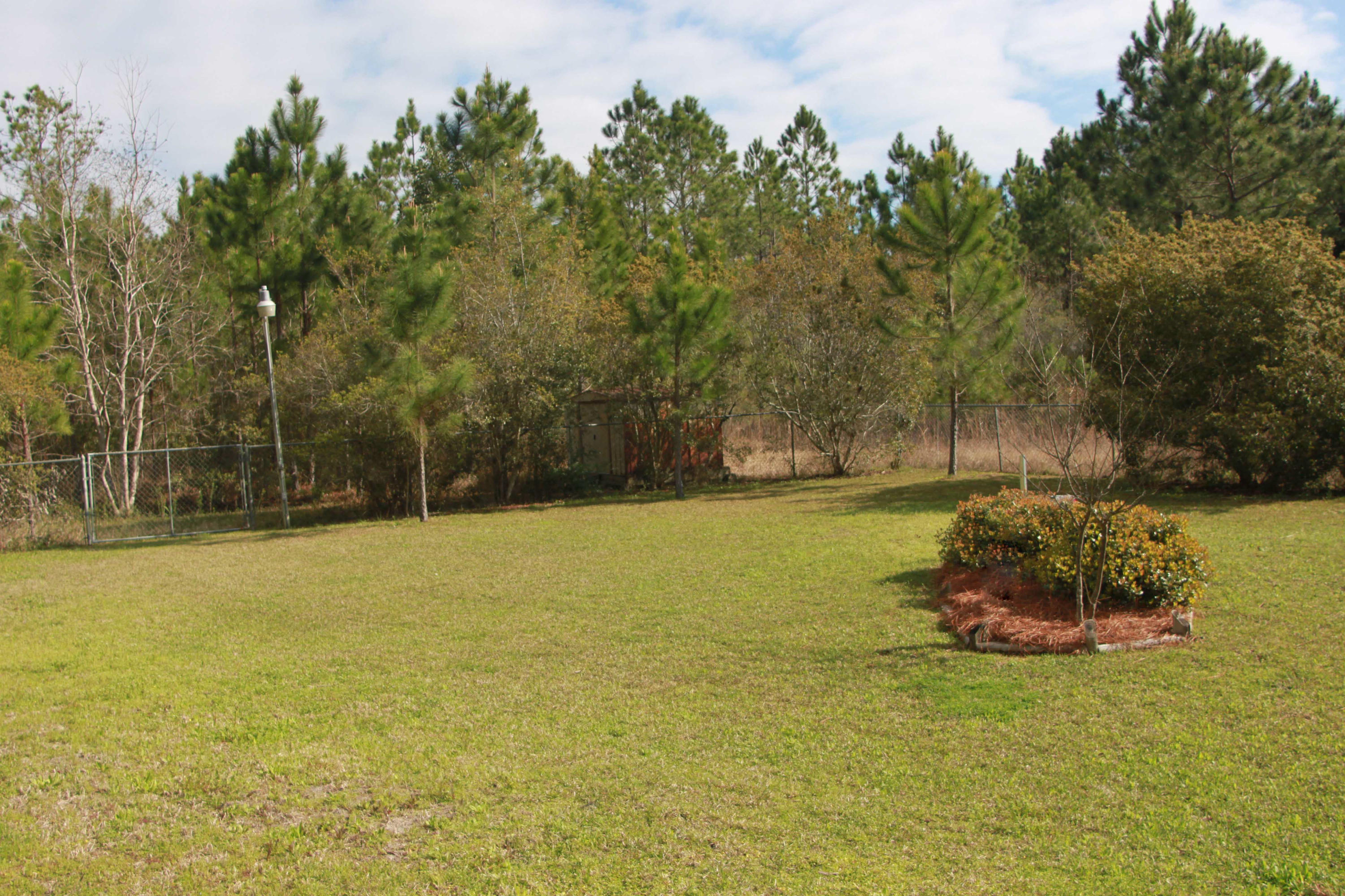 86 West Nursery Road Santa Rosa Beach, FL 32459 - Photo 4 of 20 a view of a lake with a yard