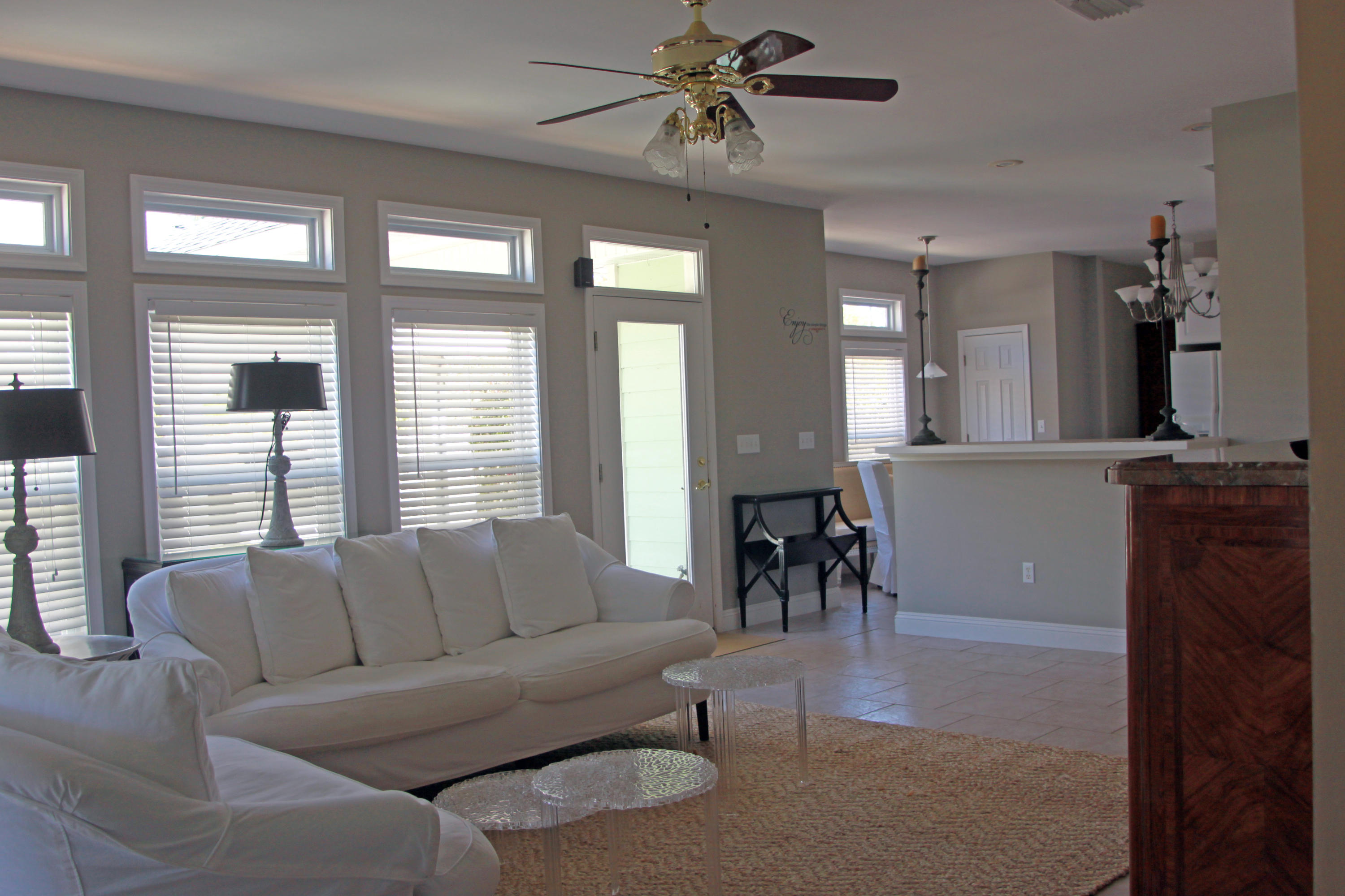 86 West Nursery Road Santa Rosa Beach, FL 32459 - Photo 5 of 20 a living room with furniture and a chandelier