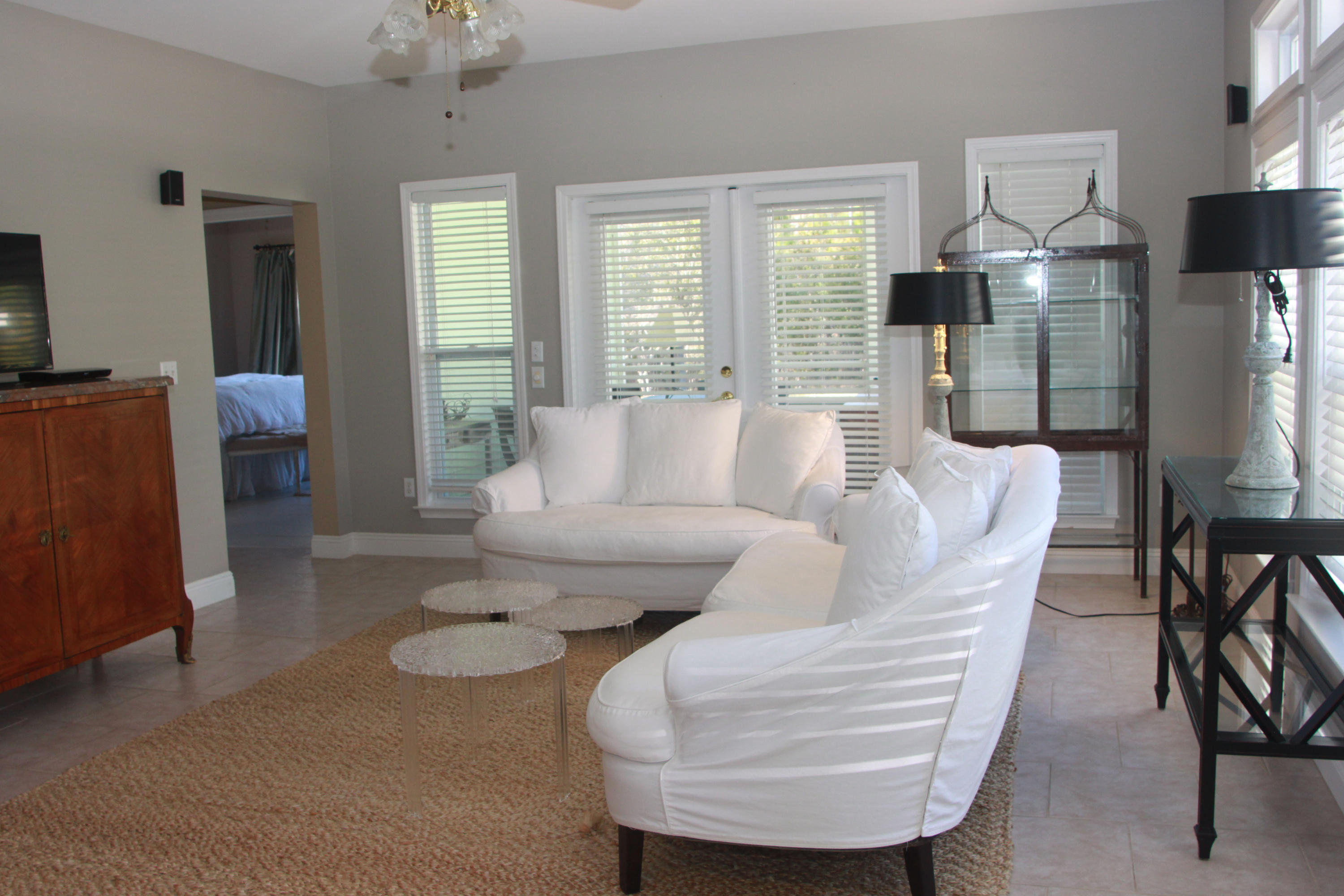86 West Nursery Road Santa Rosa Beach, FL 32459 - Photo 7 of 20 a living room with furniture a lamp and a chandelier