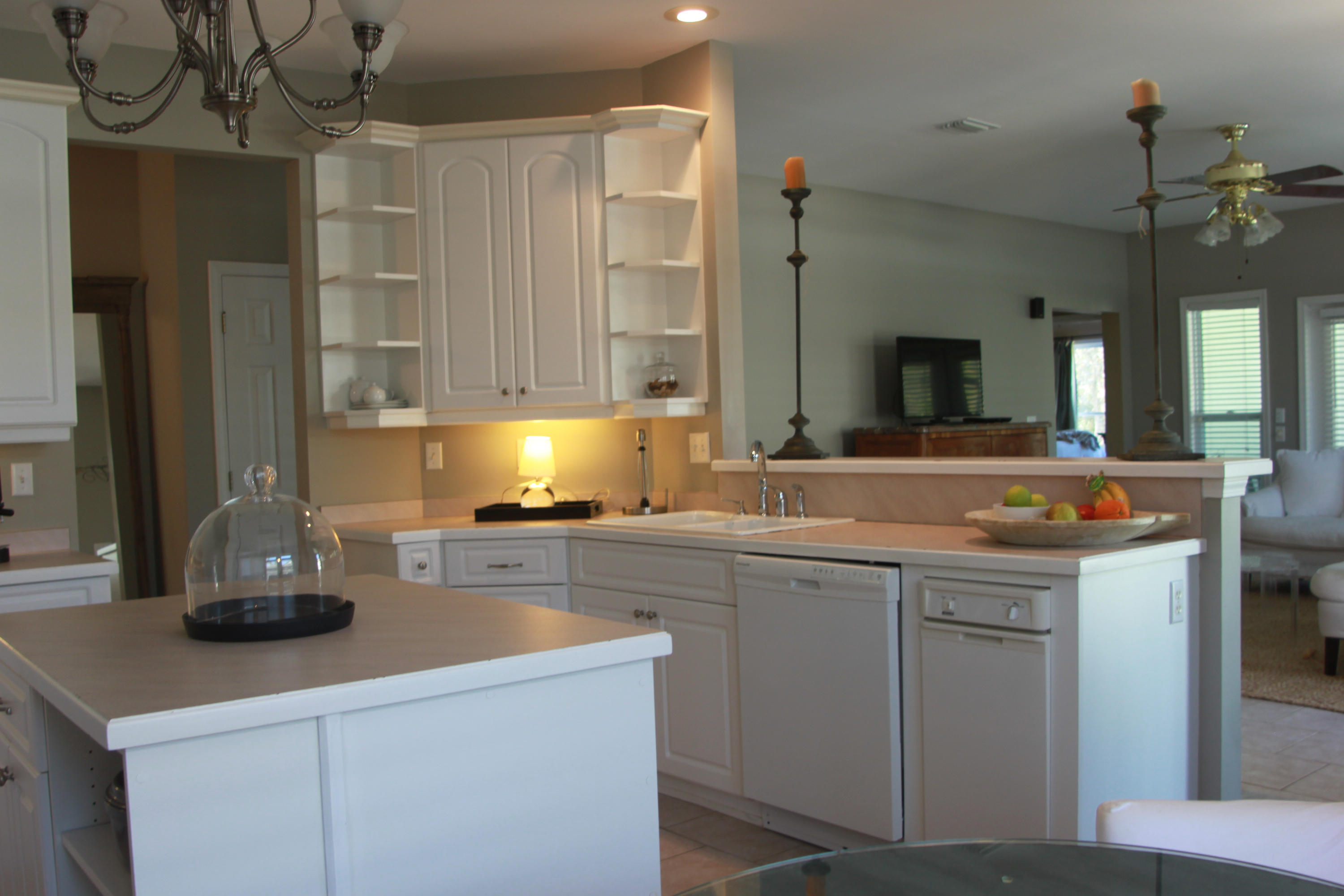86 West Nursery Road Santa Rosa Beach, FL 32459 - Photo 8 of 20 a kitchen with stainless steel appliances a sink stove and refrigerator