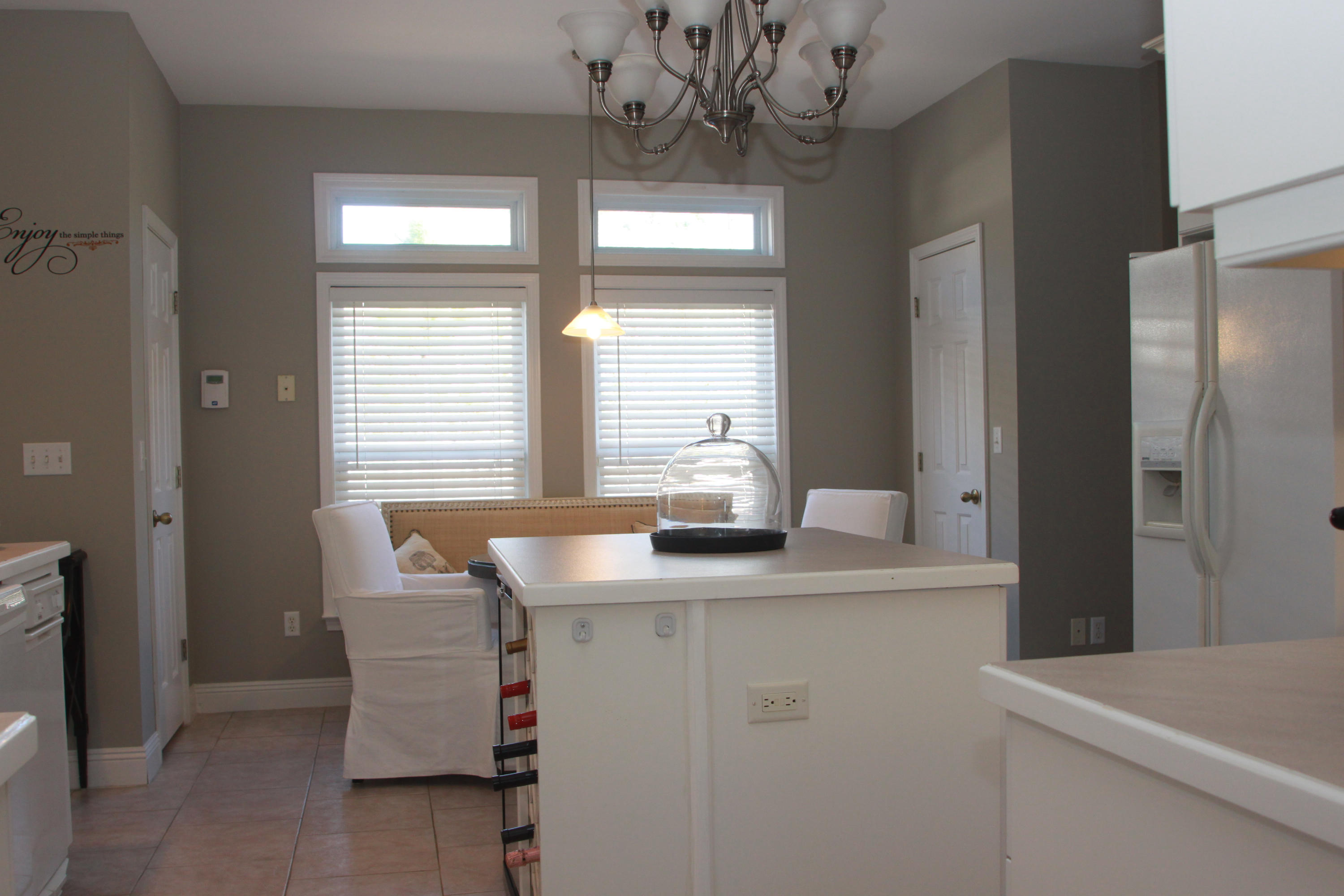 86 West Nursery Road Santa Rosa Beach, FL 32459 - Photo 10 of 20 a kitchen with a table and chairs