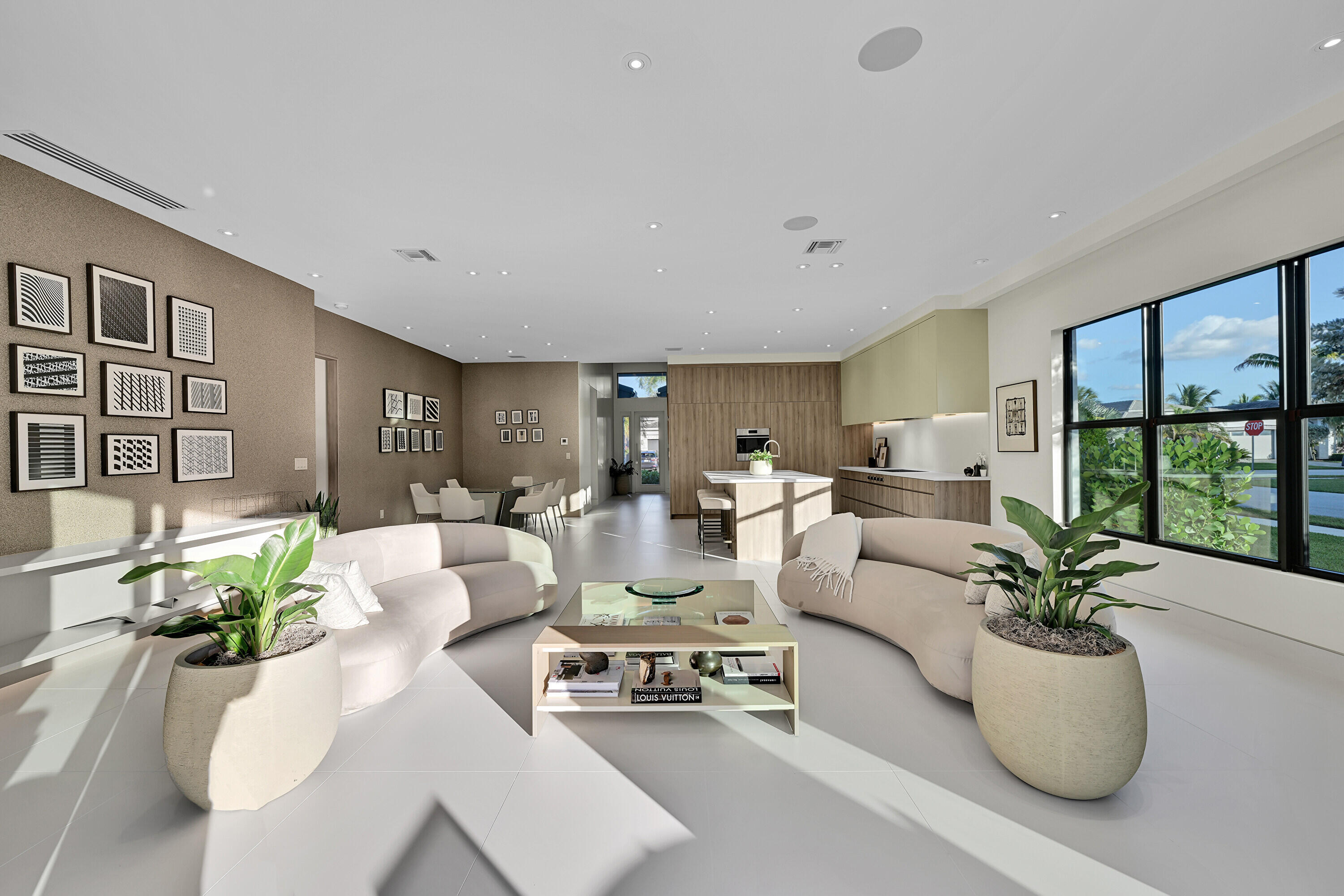 8538 Apple Falls Lane Boca Raton, FL 33496 - Photo 11 of 28 a living room with furniture potted plant and a large window