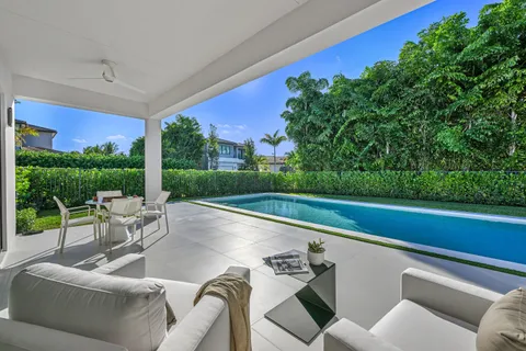 a view of a patio with couches chairs and a table