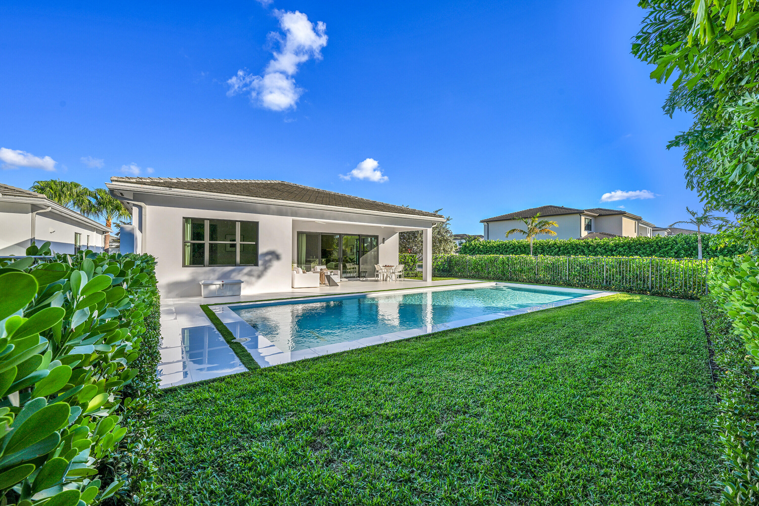 8538 Apple Falls Lane Boca Raton, FL 33496 - Photo 22 of 28 a view of a house with a swimming pool
