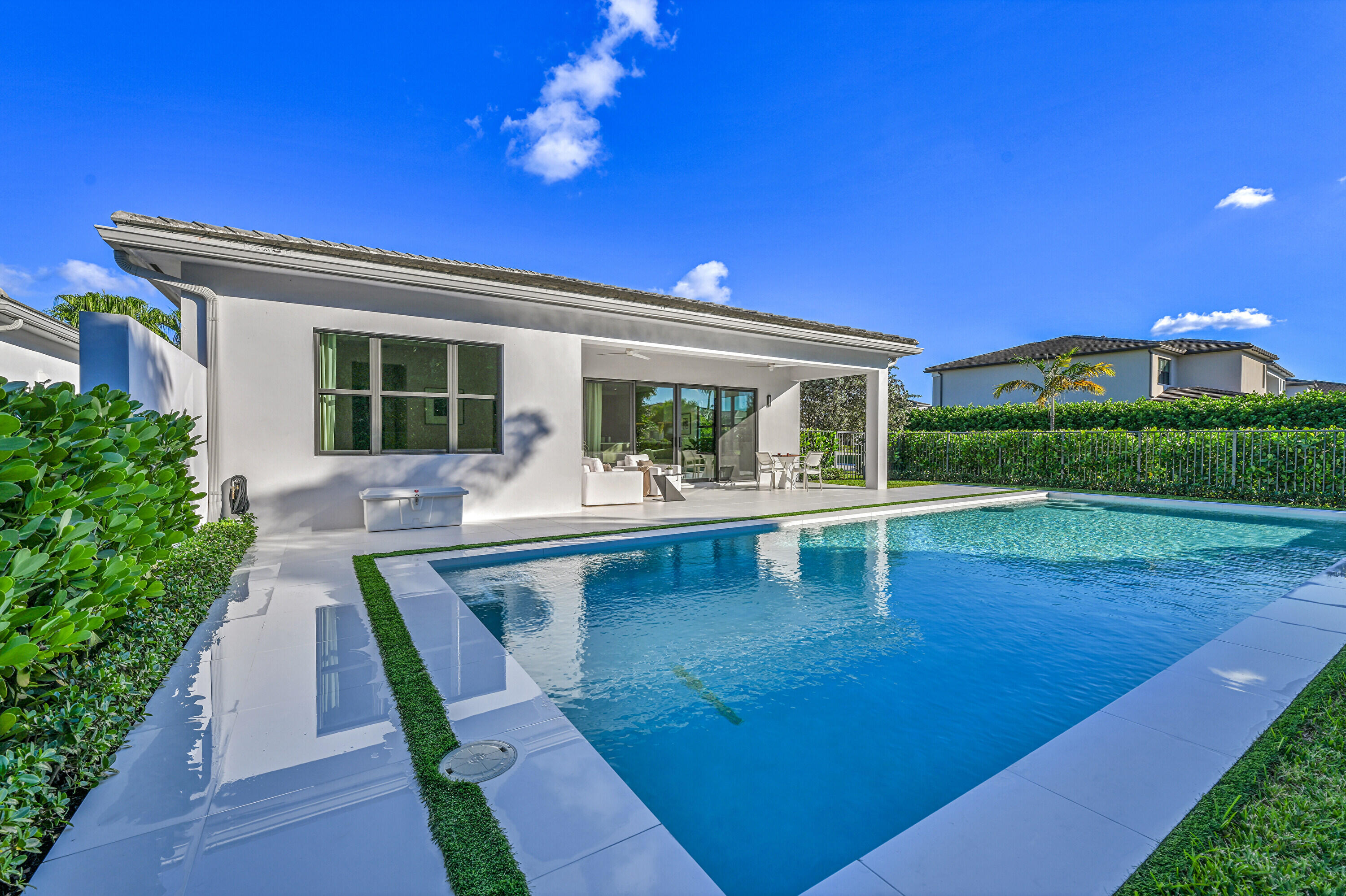 8538 Apple Falls Lane Boca Raton, FL 33496 - Photo 24 of 28 a view of house with swimming pool yard and outdoor seating