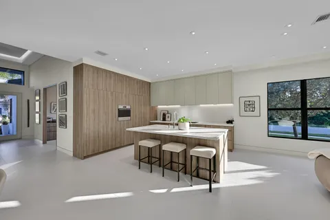 a living room with a table and chairs