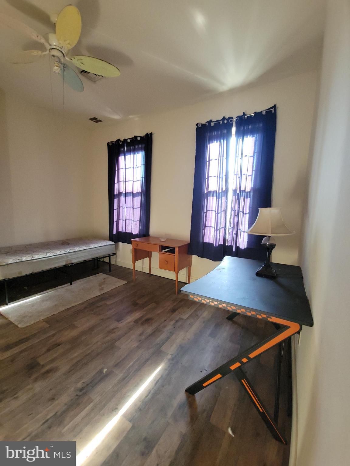 565 Main Street Lykens, PA 17048 - Photo 16 of 29 a room with wooden floor and a window