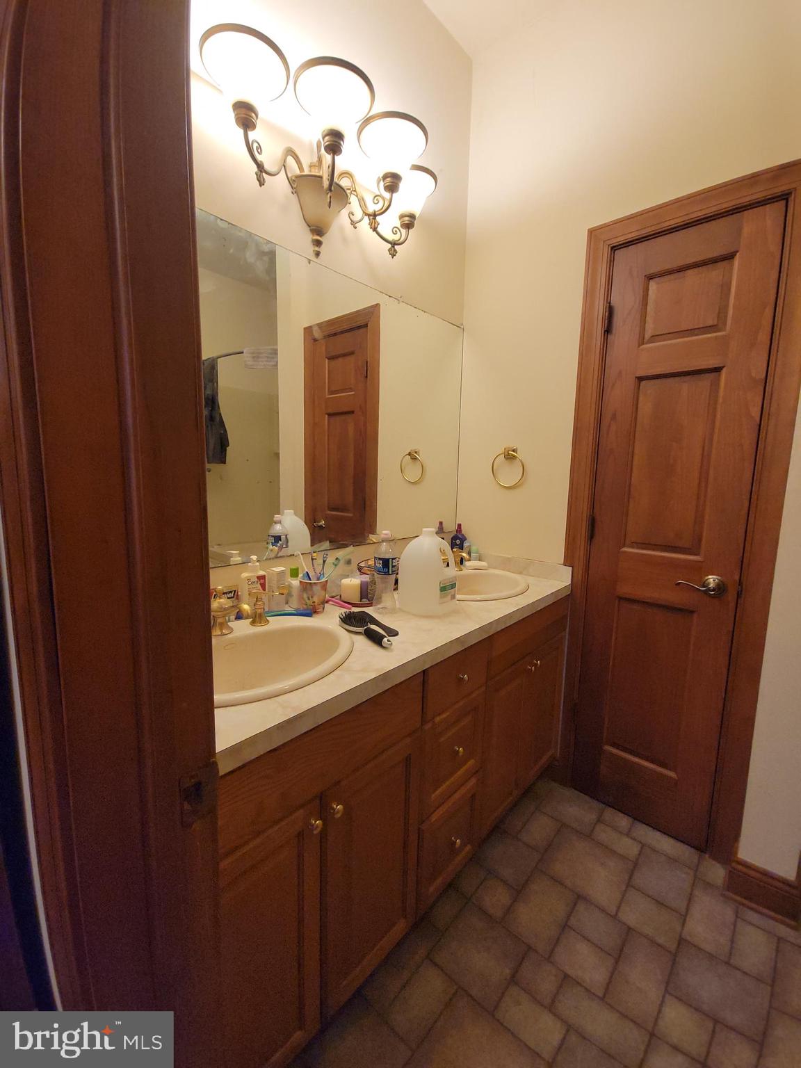 565 Main Street Lykens, PA 17048 - Photo 20 of 29 a bathroom with a double vanity sink and mirror