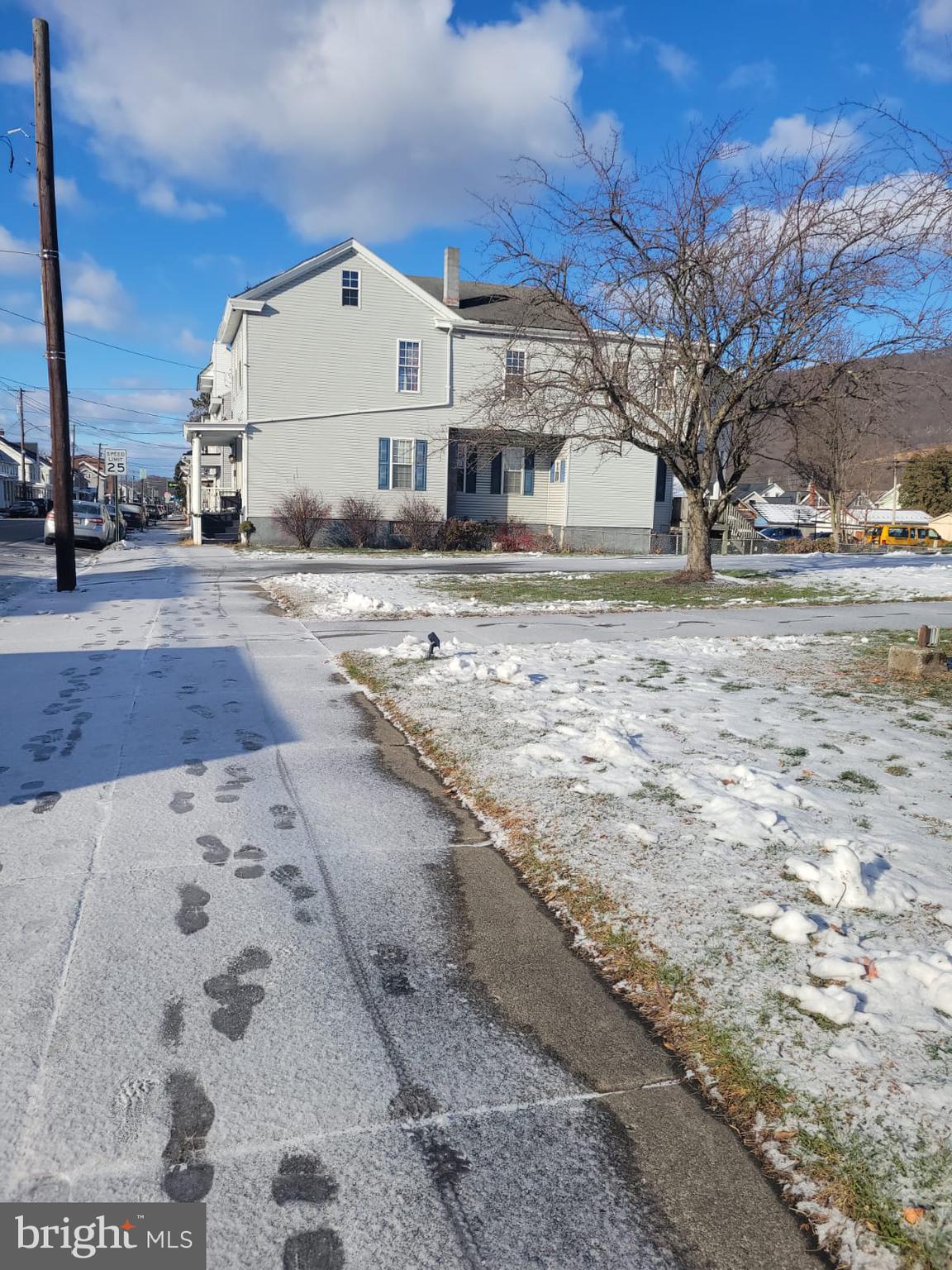 565 Main Street Lykens, PA 17048 - Photo 2 of 29 a view of a white house with a yard