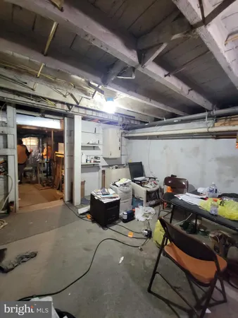 a living room with furniture a table and chairs