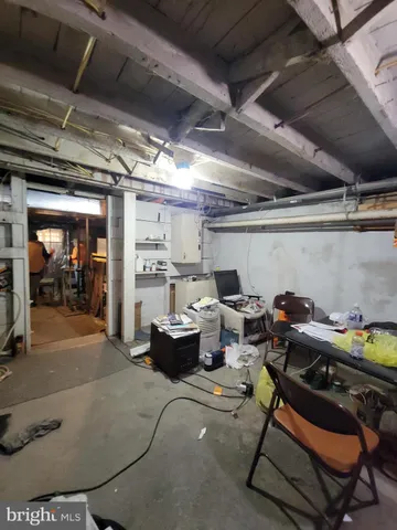 a living room with furniture a table and chairs