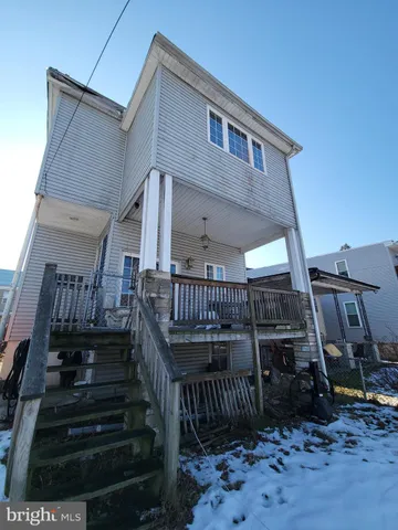a view of entryway with wooden stairs