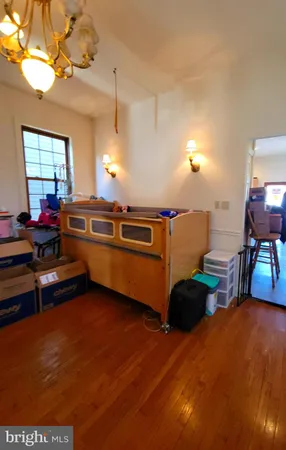 a view of a room with furniture and a chandelier