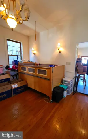 a view of a room with furniture and a chandelier