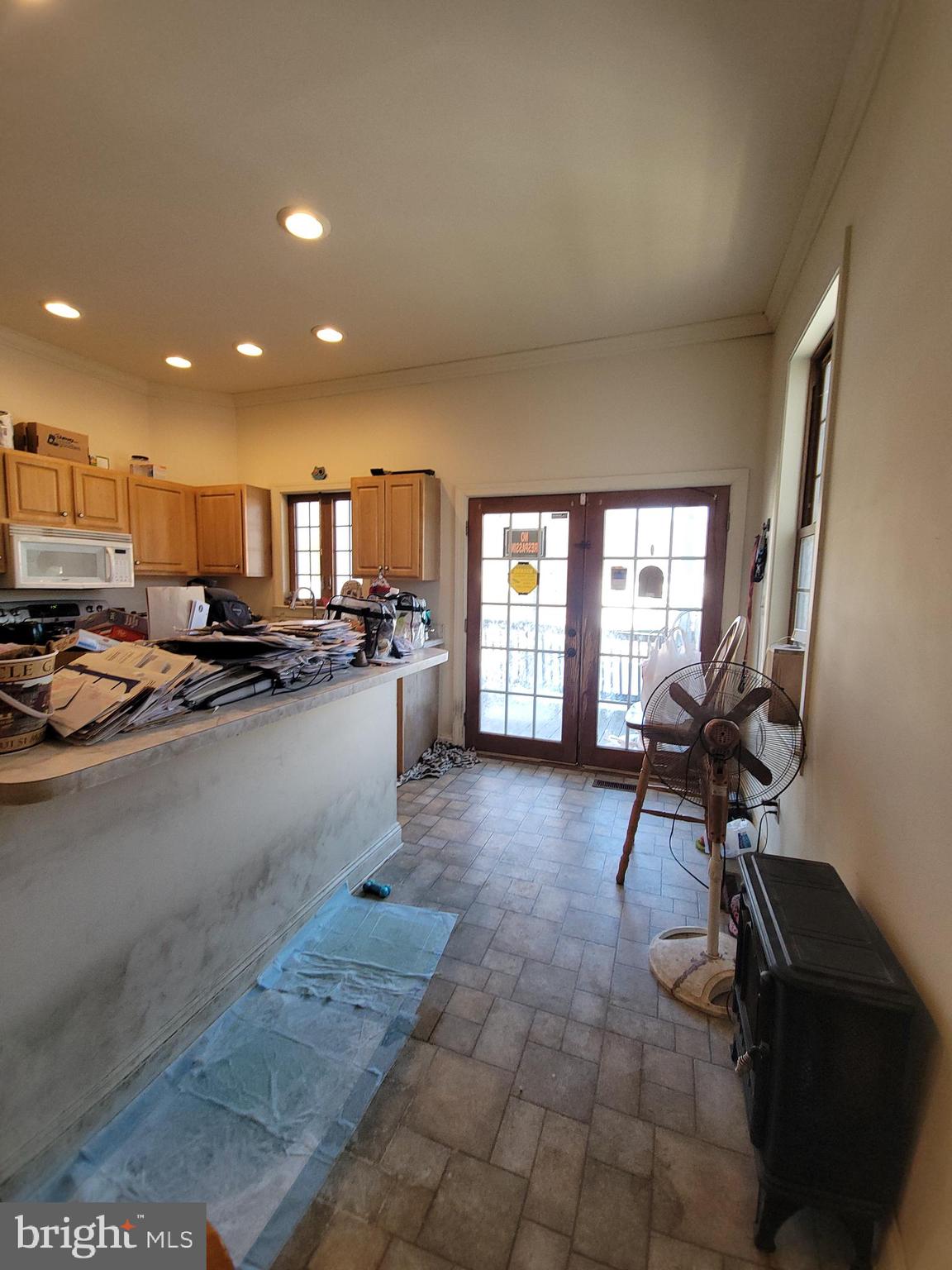 565 Main Street Lykens, PA 17048 - Photo 7 of 29 a view of a kitchen with kitchen island granite countertop lots of counter top space a sink and appliances