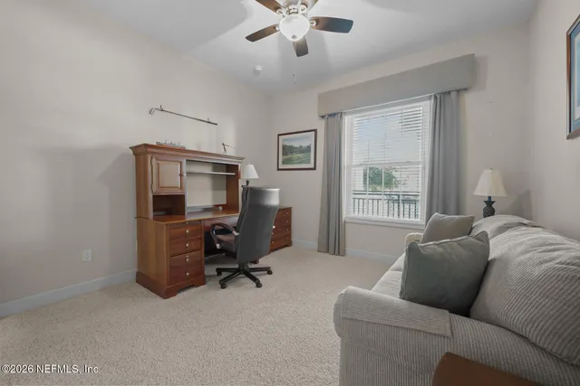 a living room with furniture and a window