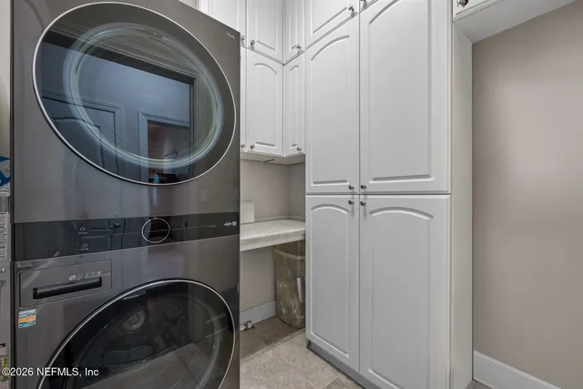 a utility room with a sink dryer and washer