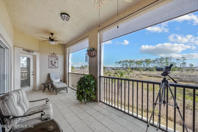 a view of a balcony with furniture
