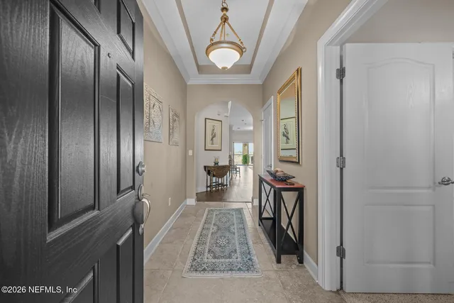 a view of a hallway view with wooden floor and staircase