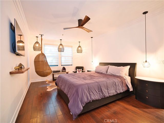 a bedroom with bed and window