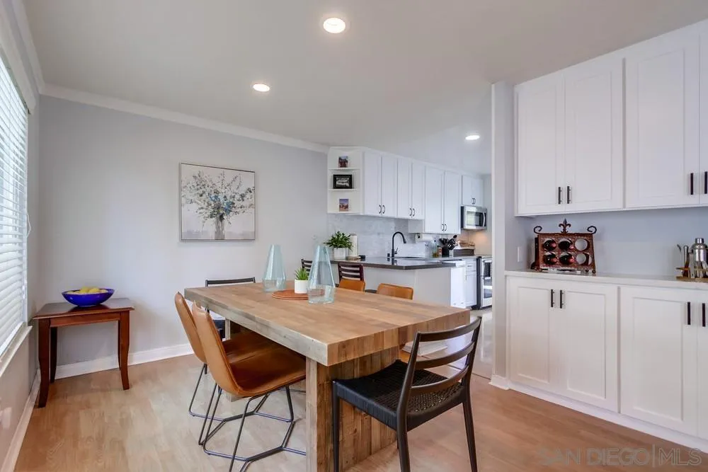 284 Gardendale Road Encinitas, CA 92024 - Photo 21 of 59 a dining room with a wooden table and chairs