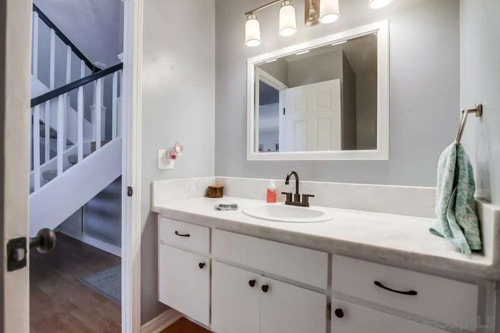 284 Gardendale Road Encinitas, CA 92024 - Photo 33 of 59 a bathroom with a sink and a mirror