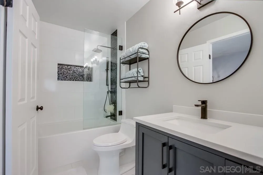 284 Gardendale Road Encinitas, CA 92024 - Photo 37 of 59 a bathroom with a sink a toilet and a mirror