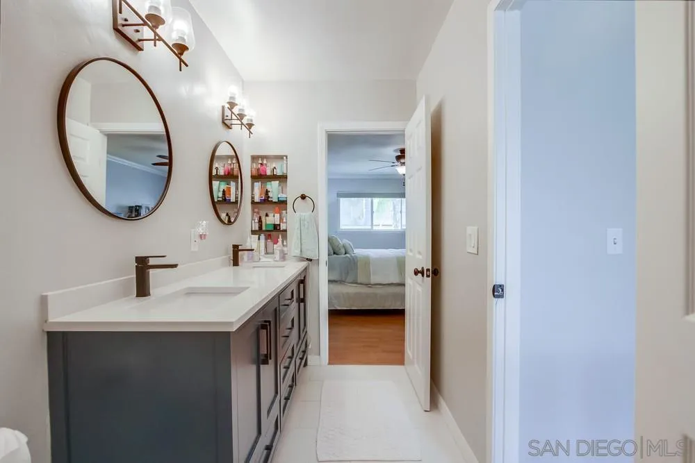 284 Gardendale Road Encinitas, CA 92024 - Photo 38 of 59 a en suite bathroom with a sink and a mirror