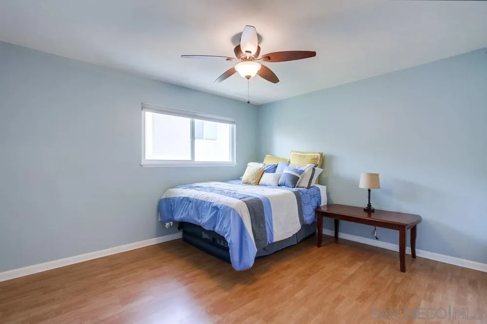 284 Gardendale Road Encinitas, CA 92024 - Photo 40 of 59 a spacious bedroom with a bed and a chandelier