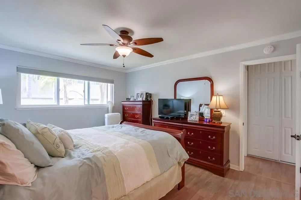 284 Gardendale Road Encinitas, CA 92024 - Photo 45 of 59 a bedroom with a bed and wooden floor