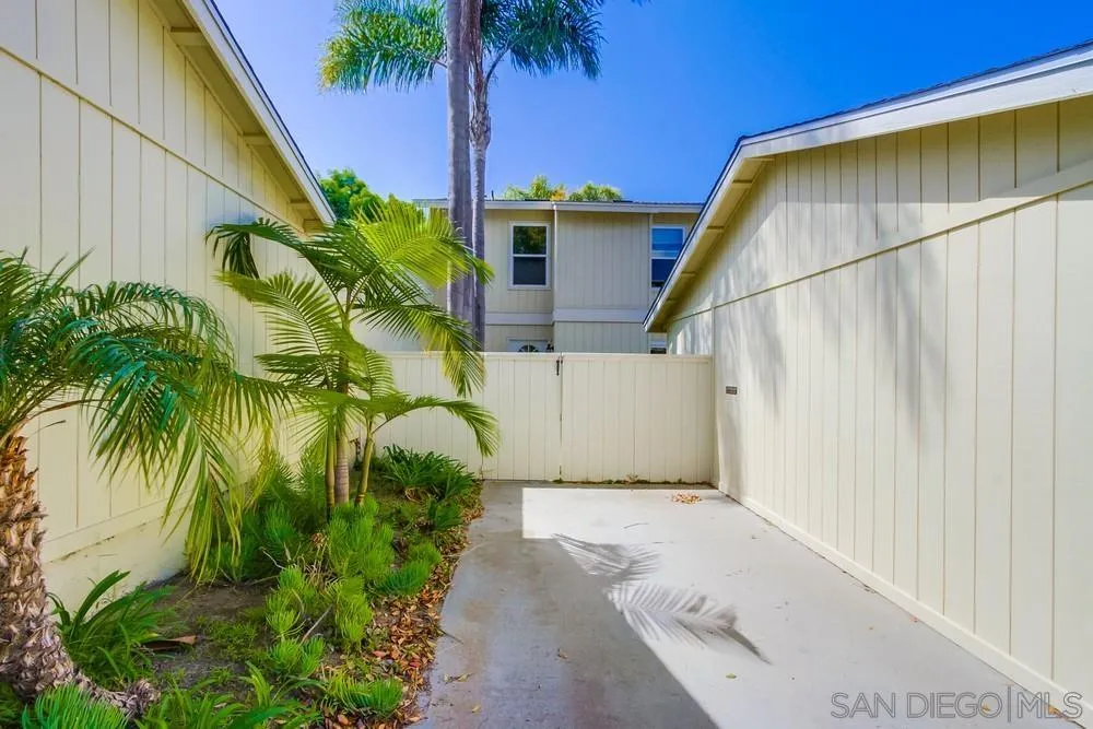 284 Gardendale Road Encinitas, CA 92024 - Photo 5 of 59 a yellow house with palm tree in front of it