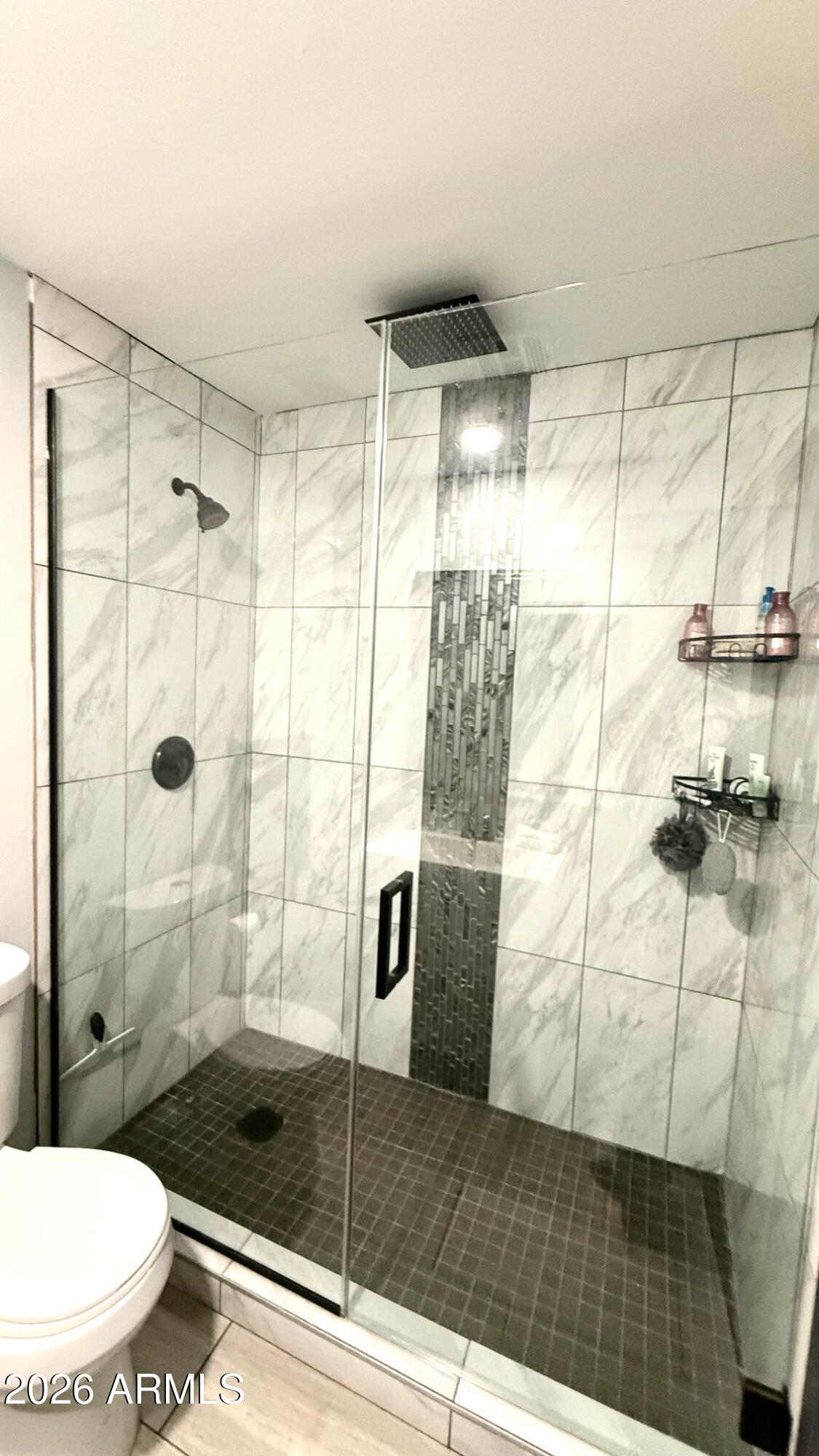 1109 West Indian School Road Phoenix, AZ 85013 - Photo 27 of 38 a bathroom with a shower