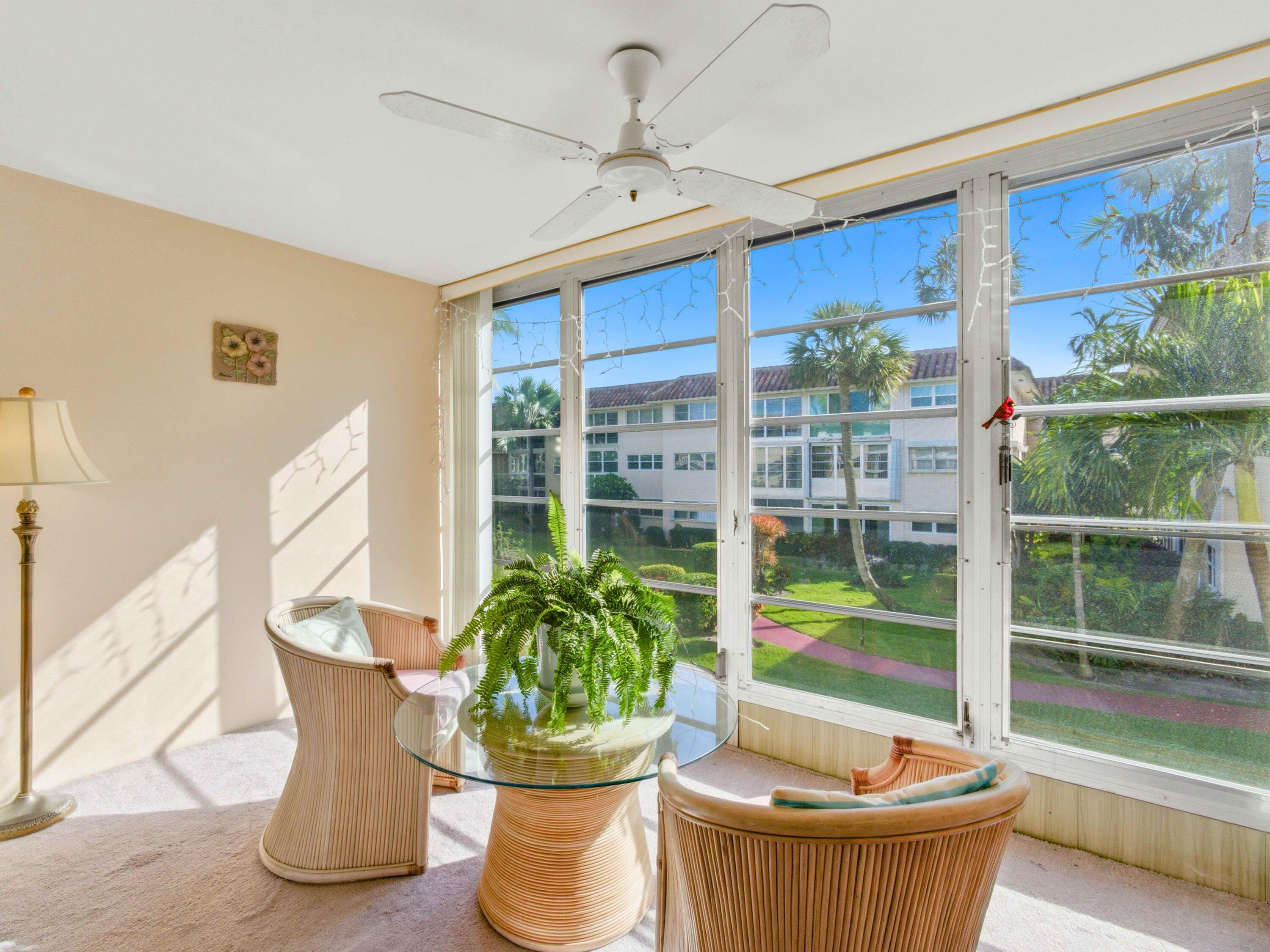 400 Northeast 20th Street, Unit A216 Boca Raton, FL 33431 - Photo 19 of 32 a dining room with furniture and garden view