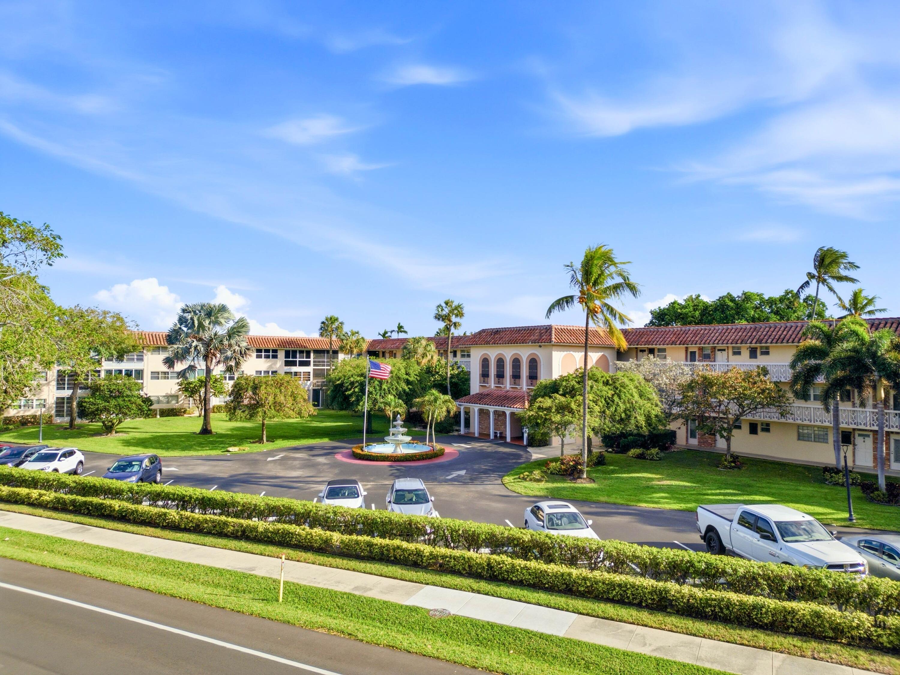 400 Northeast 20th Street, Unit A216 Boca Raton, FL 33431 - Photo 7 of 32 a front view of building with yard