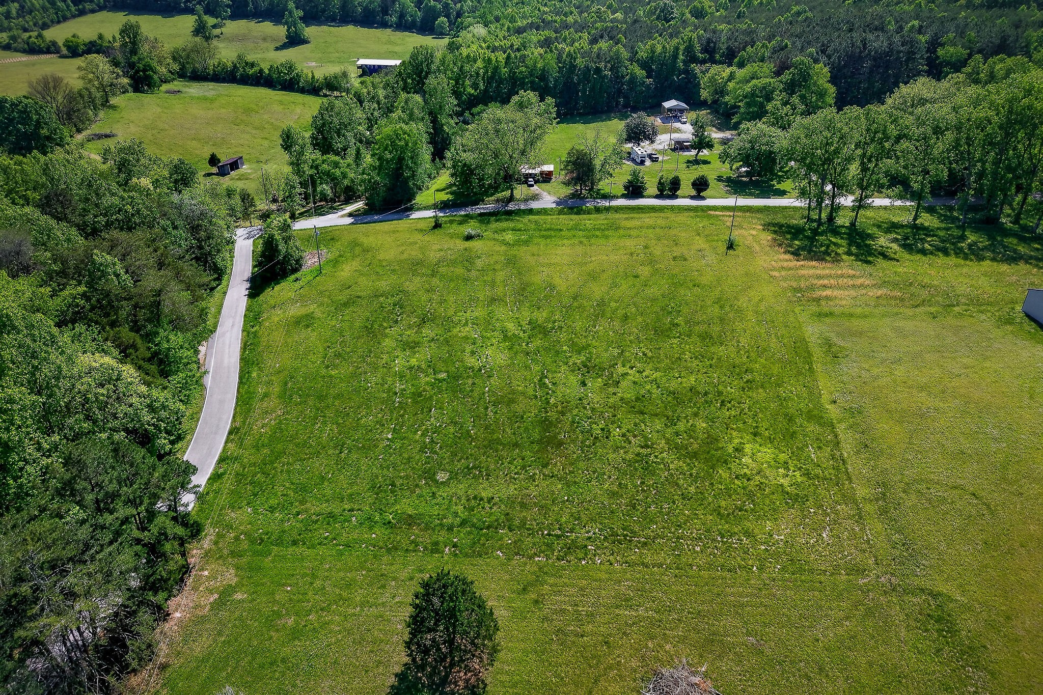 0 Sparkman Town Road Doyle, TN 38559 - Photo 5 of 11 a view of a golf course with a lake