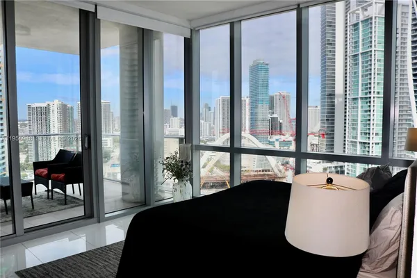 a bathroom with a sink and mirror with toilet