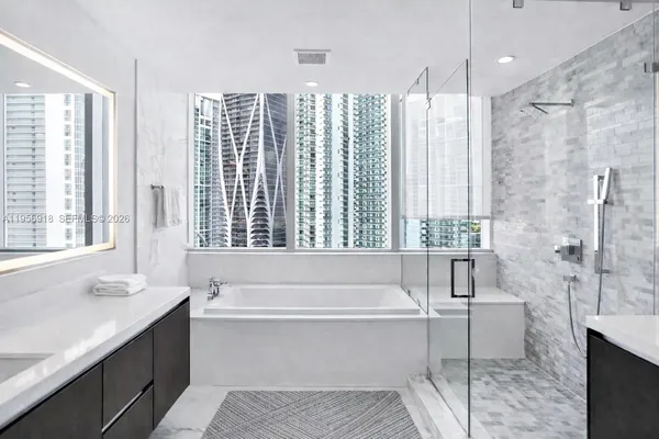 a kitchen with a sink a counter space and cabinets